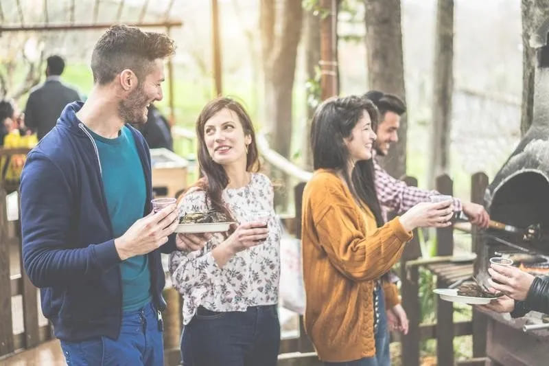 People socializing at a cookout